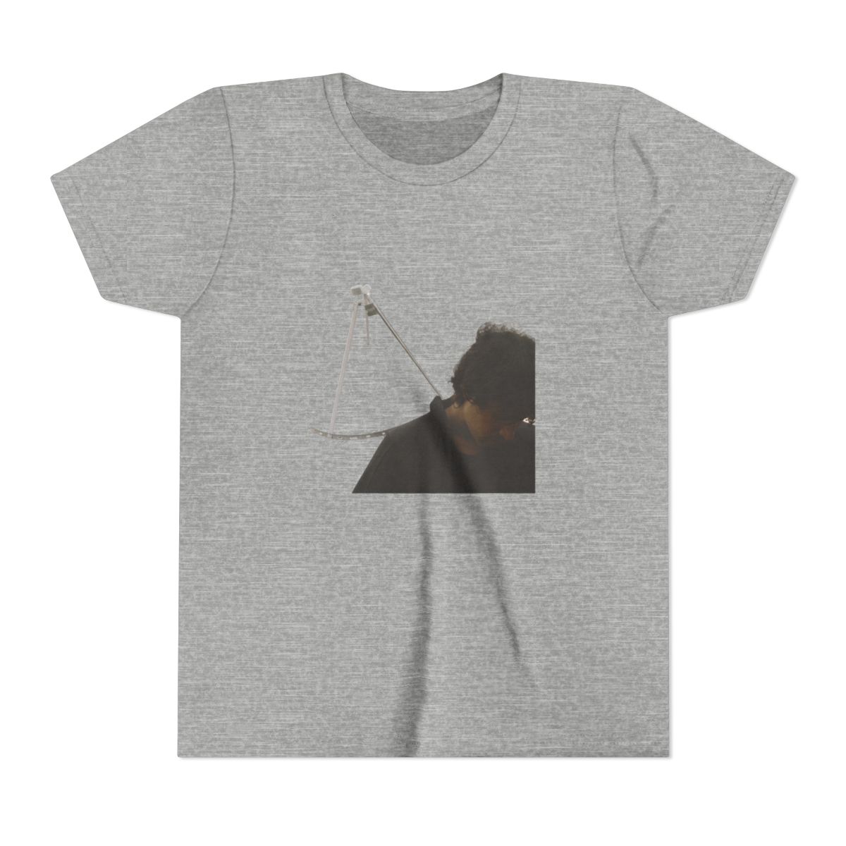 Black T Shirt with a square image of a satellite dish and a person in muted grey and beige tones. The T Shirt is made of a soft, comfortable material (Kids)